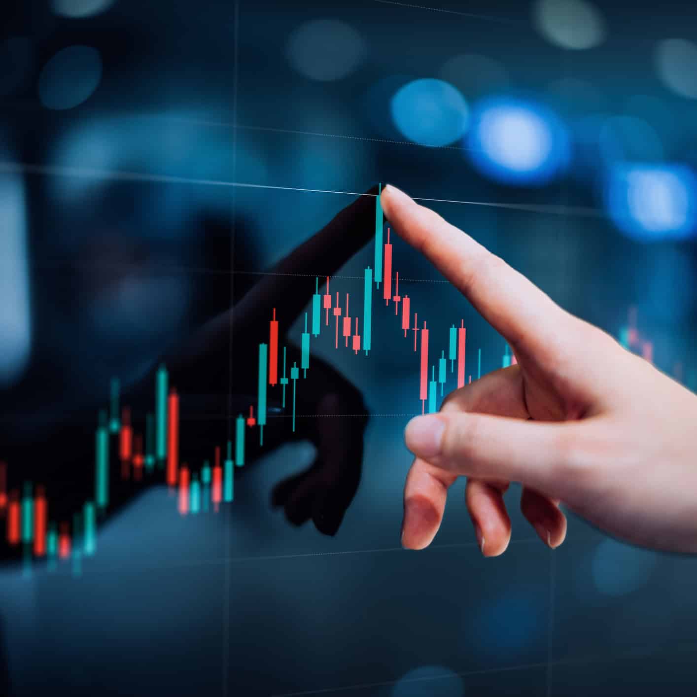 Female hand touching stock market analysis display screen