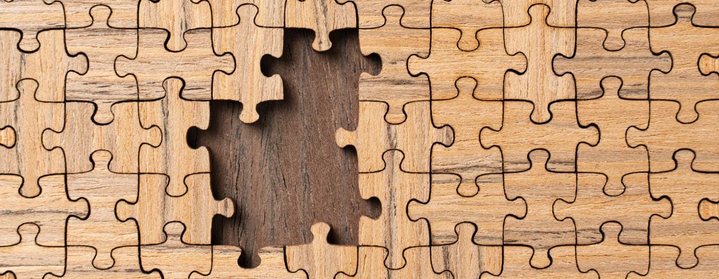 Wooden puzzle with missing pieces