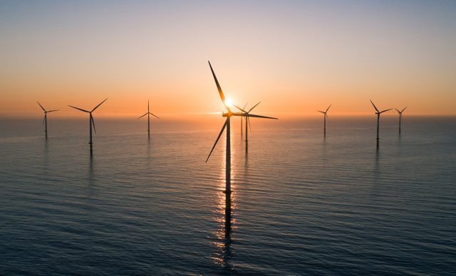 Offshore wind turbines at sunrise