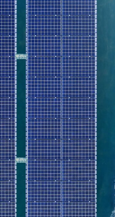 Aerial view of solar panels floating in a dam