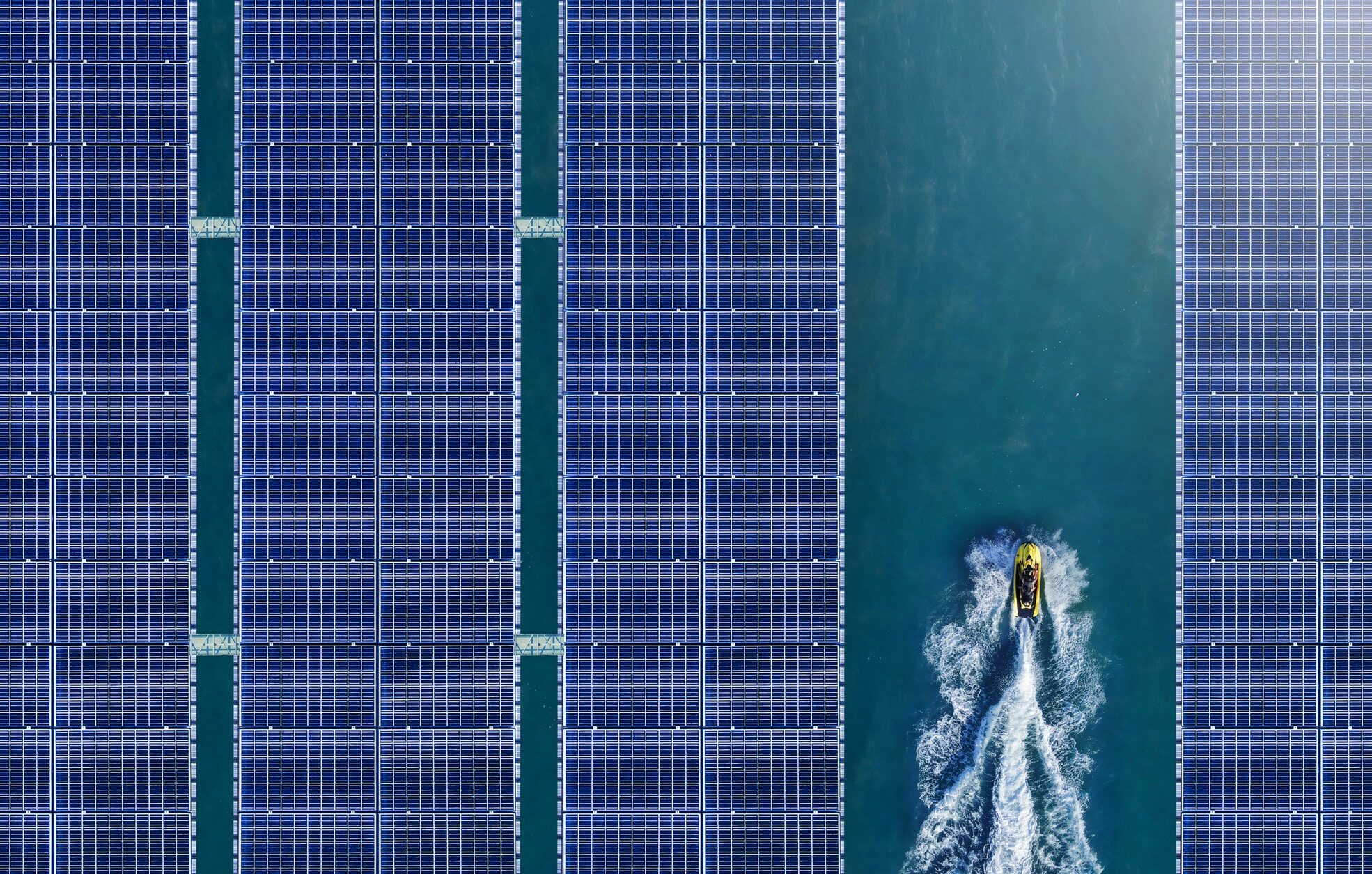 Aerial view of solar panels floating in a dam