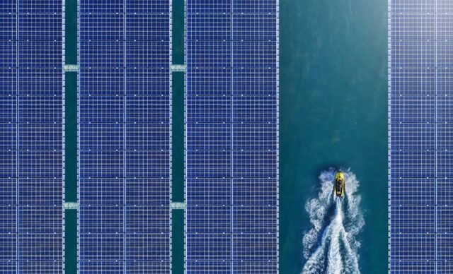 Aerial view of solar panels floating in a dam