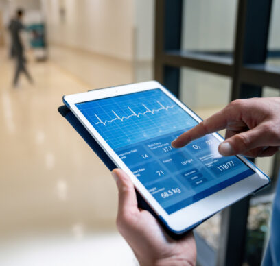 Doctor looking at digital tablet