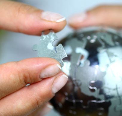 Woman holding globe puzzle