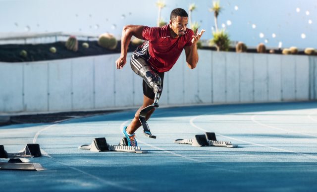 Athlete running with prosthetic legs