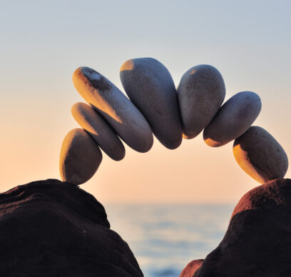 Arc of pebbles between of the stones on the coast